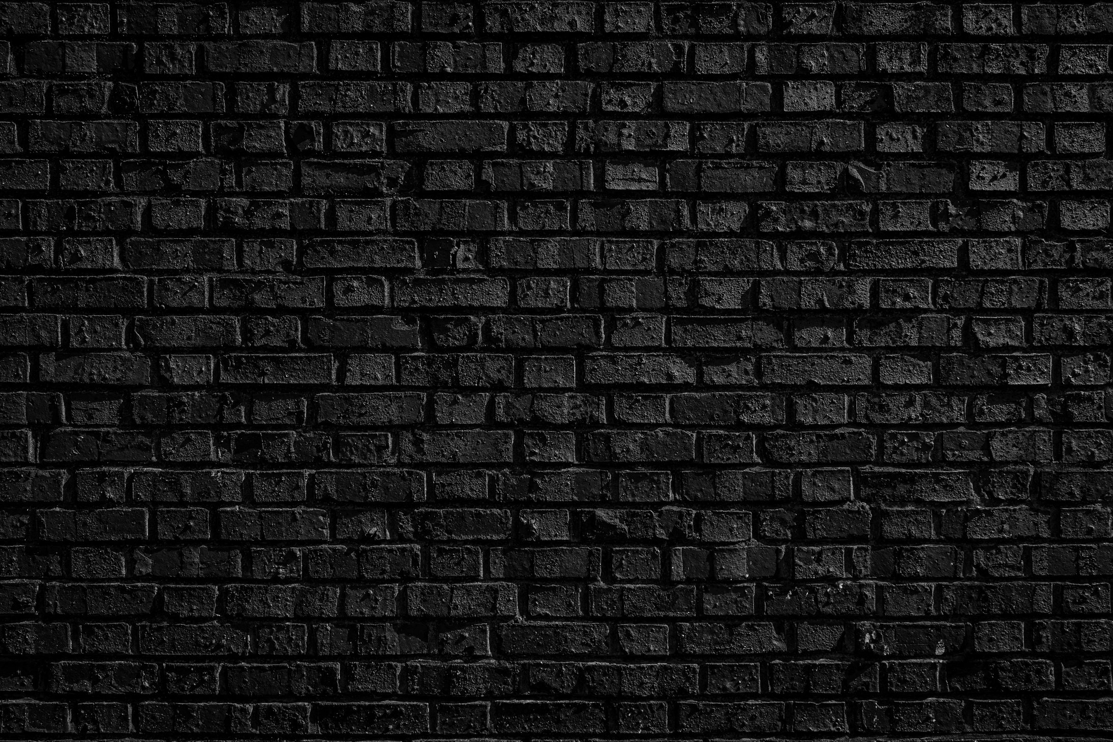 Broken rough textured black brick background